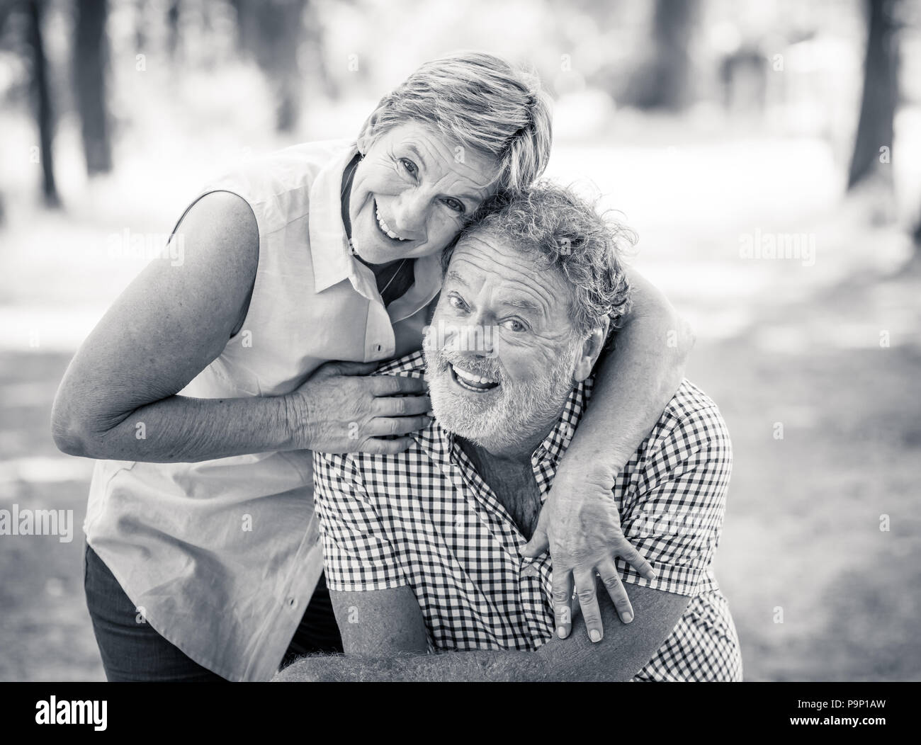 Black and white portrait of a happy smiling senior couple in love ...