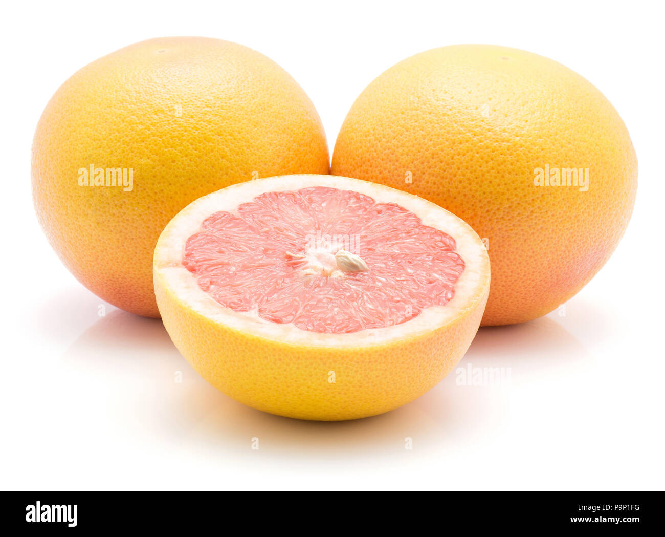 Red grapefruits isolated on white background two whole one half Stock Photo