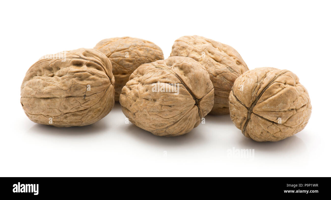 Unshelled walnuts isolated on white background five whole Stock Photo