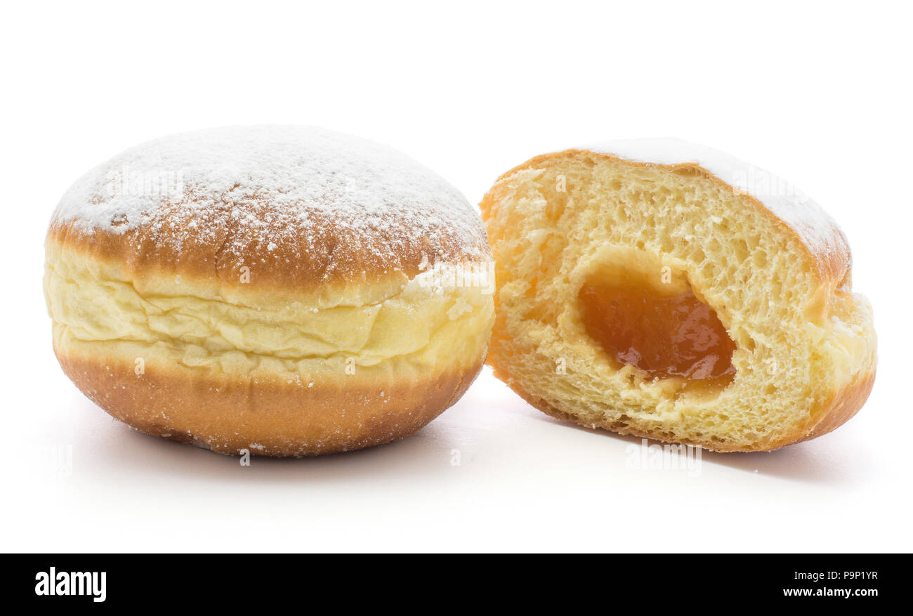 Traditional doughnut (Sufganiyah) and one sliced half with apricot jam