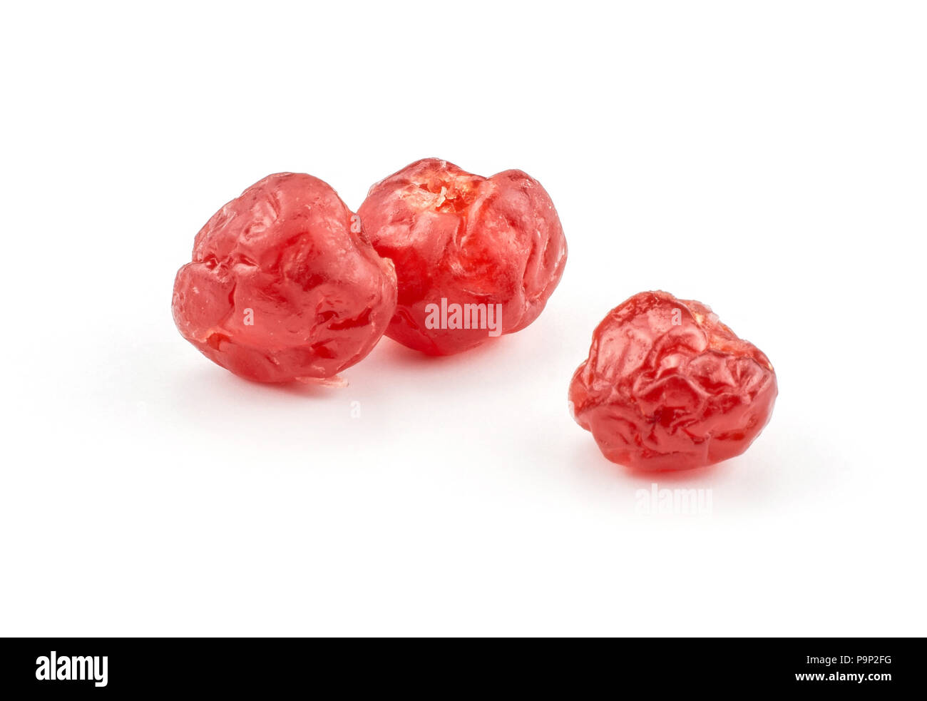 Two red dry cherries isolated on white background Stock Photo