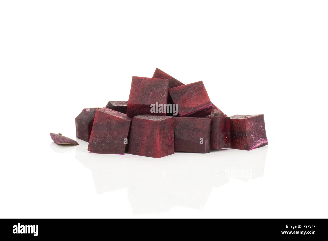 Red beet slices cut squared pieces isolated on white background Stock Photo