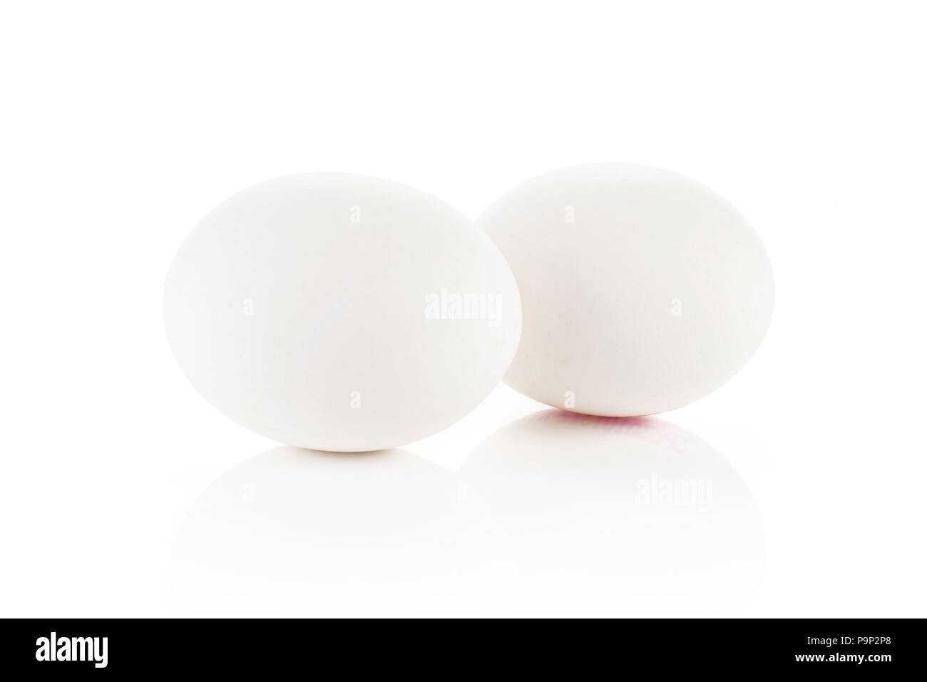 Two white chicken eggs isolated on white background Stock Photo - Alamy