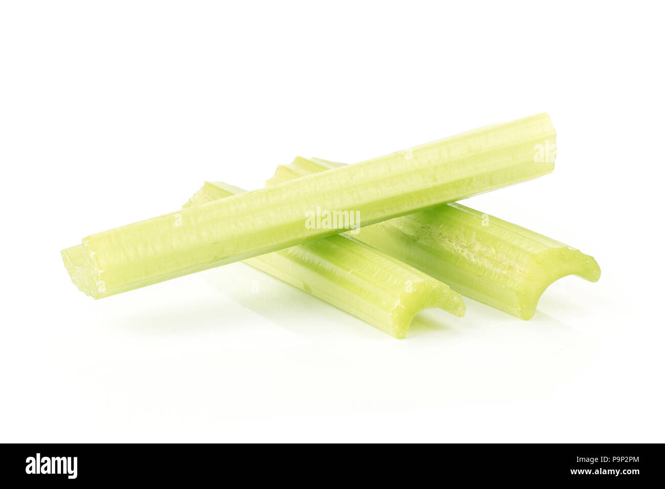 Three green celery sticks isolated on white background Stock Photo