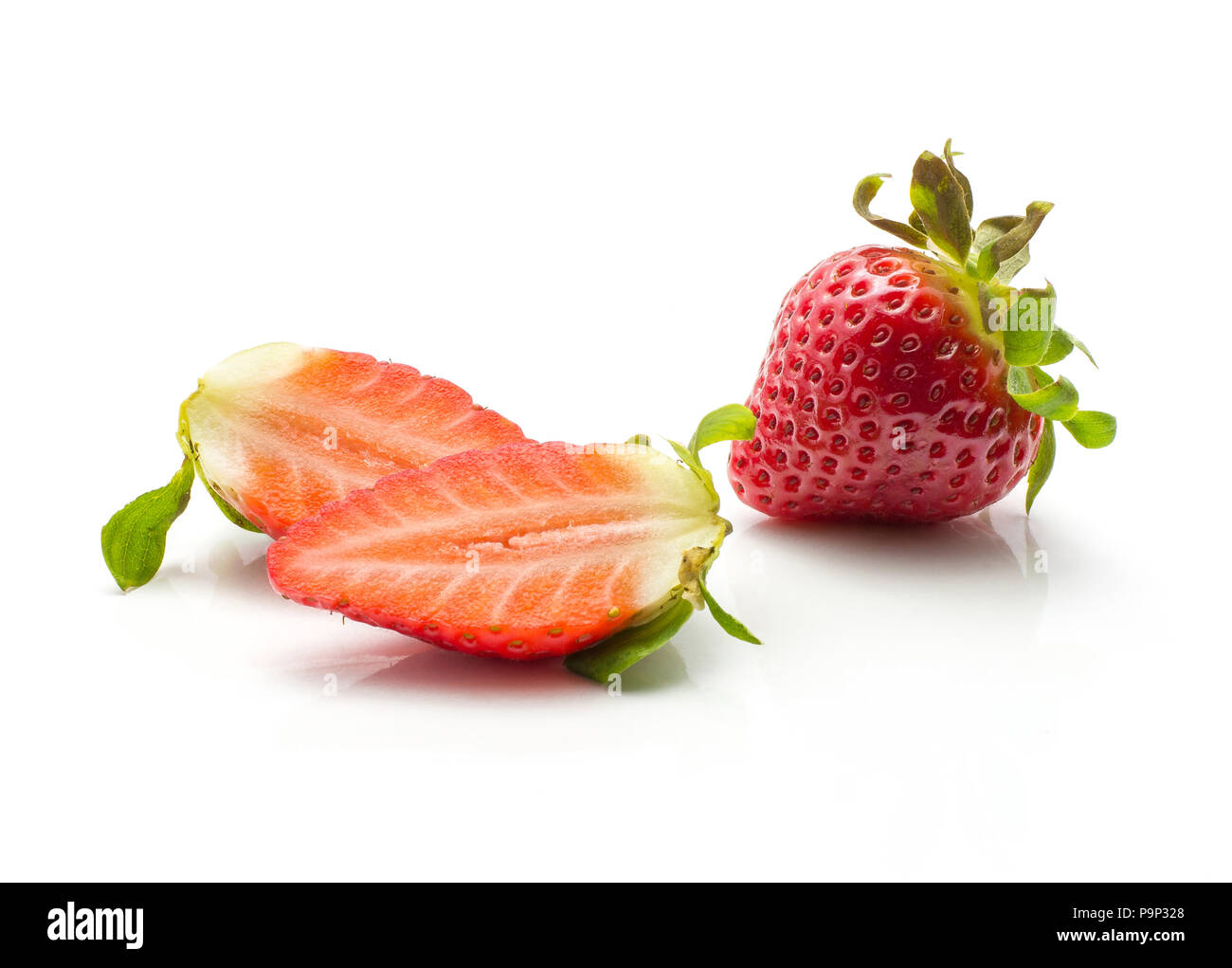 One garden strawberry and two halves isolated on white background Stock Photo