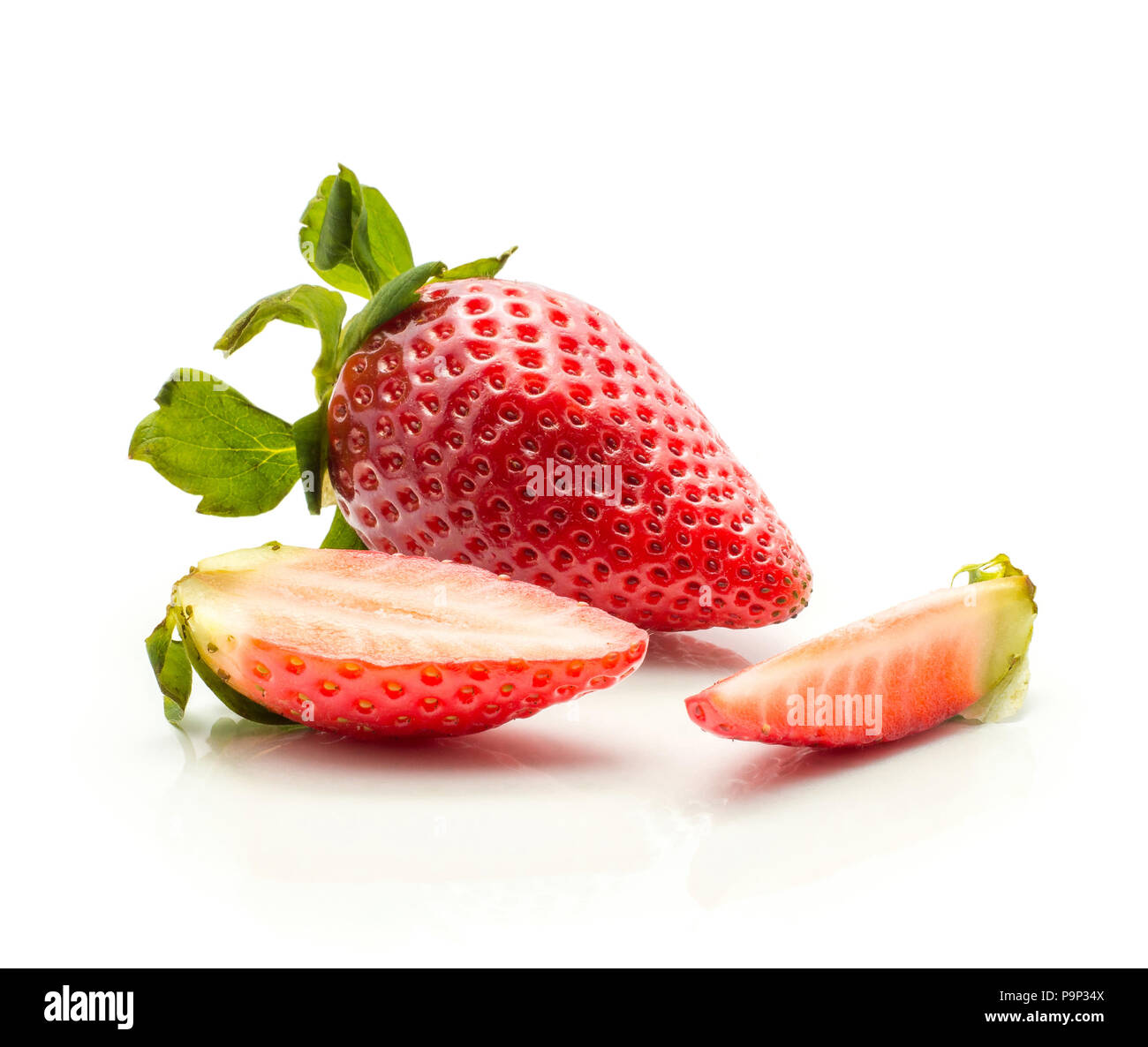 Garden strawberry one half and a slice isolated on white background fresh cut Stock Photo