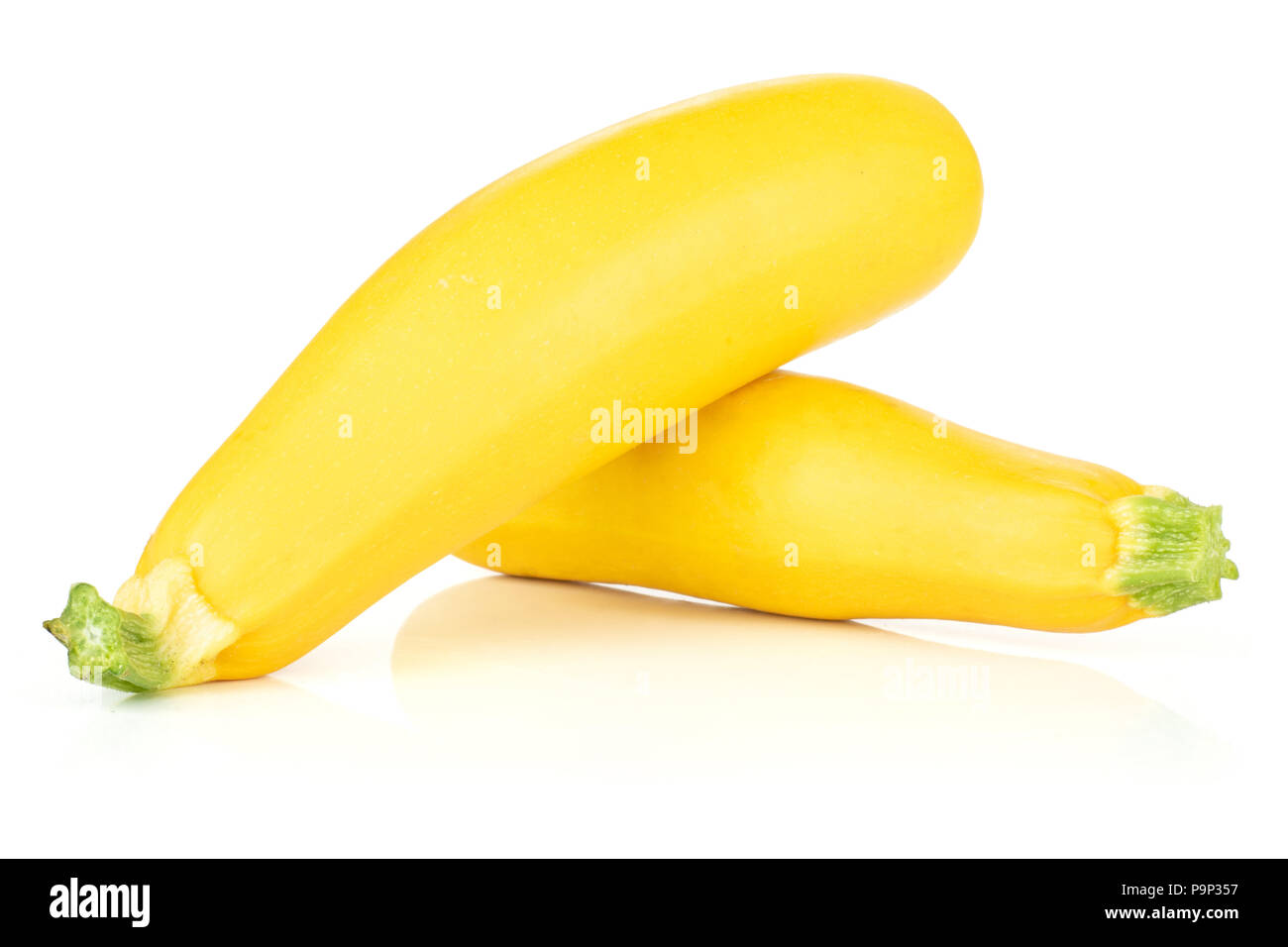Group of two whole raw yellow zucchini isolated on white Stock Photo