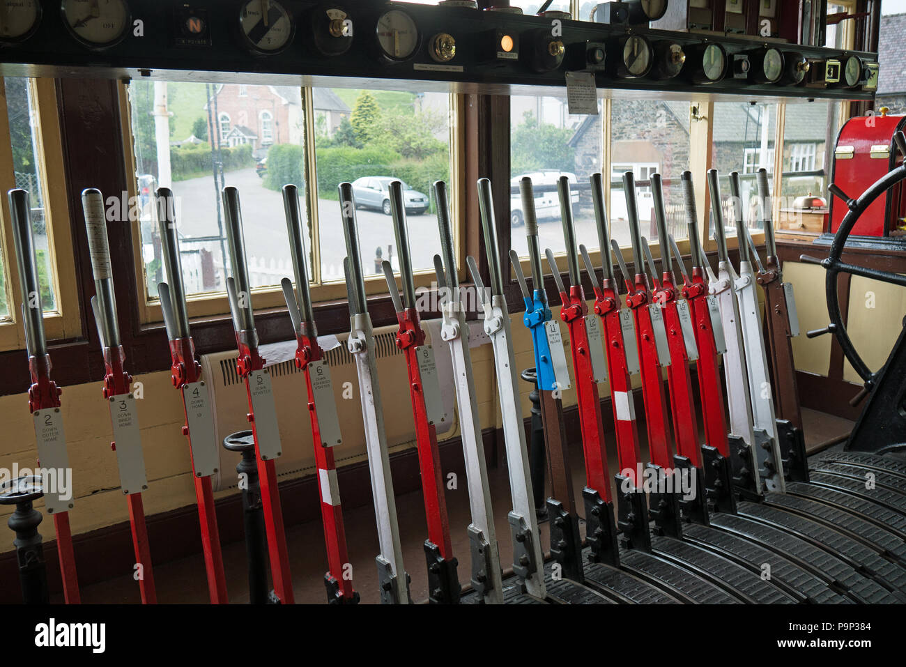 Rail-way signal-box control point with it's colourfull levers. June 09 2016 - Glyndyfrdwy Railway Station, Wales, UK. Stock Photo