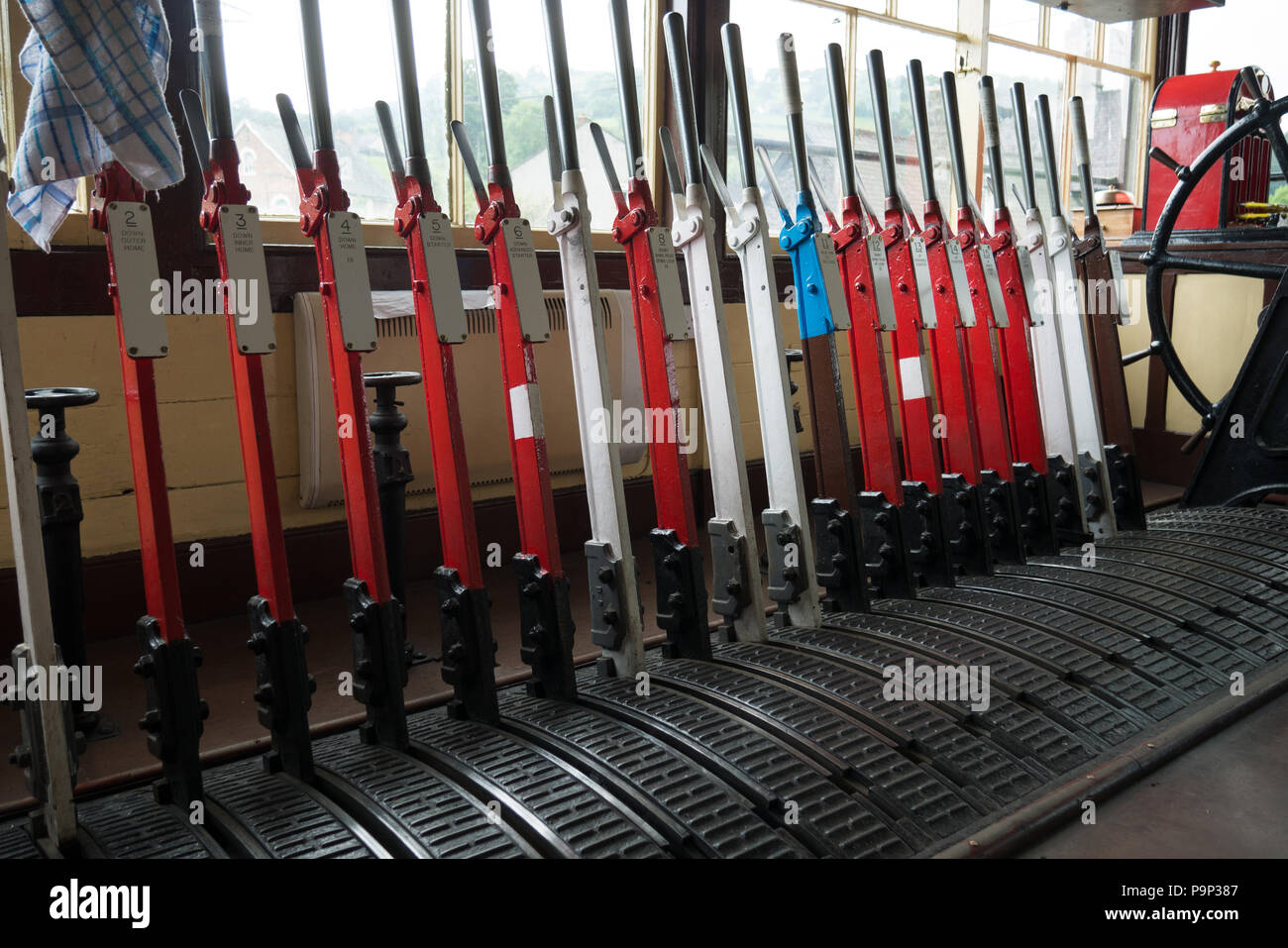Rail-way signal-box control point with it's colourfull levers. Glyndyfrdwy Station, Wales, UK. June 09 2016 - Stock Photo