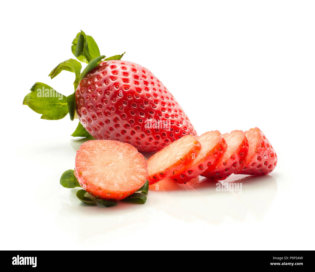 Garden strawberry and one sliced in circles isolated on white background Stock Photo