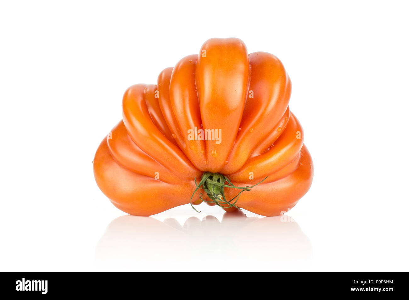 White Triangle Ripe One beef tomato (triangle shape) isolated on white background big ripe ...