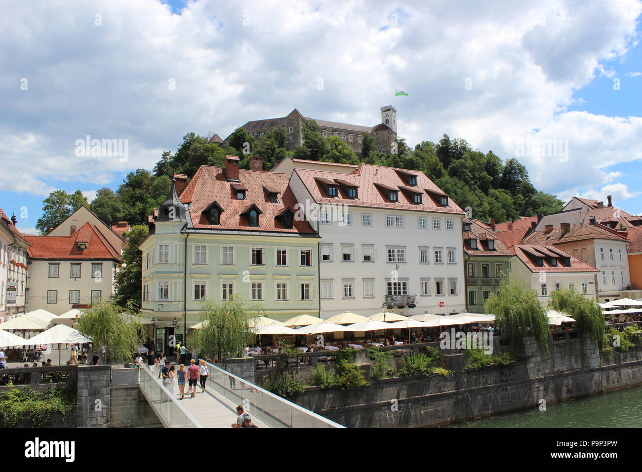 A charming scene from the center of Ljubljana, the Ljubljana castle is on the top. Stock Photo