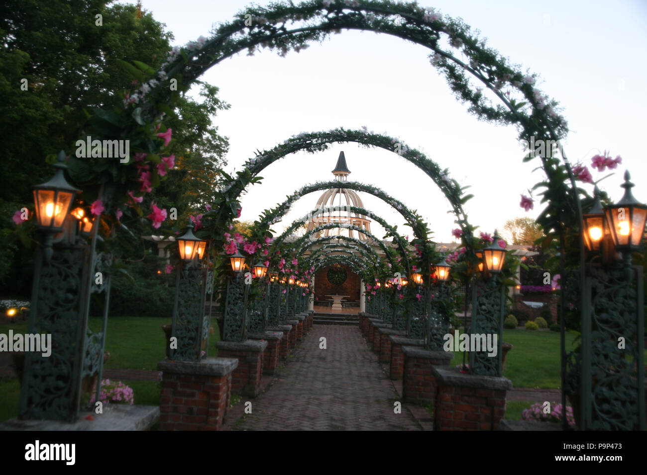 USA, West Orange, New Jersey, an arched flowery garden  walkway structure. Stock Photo