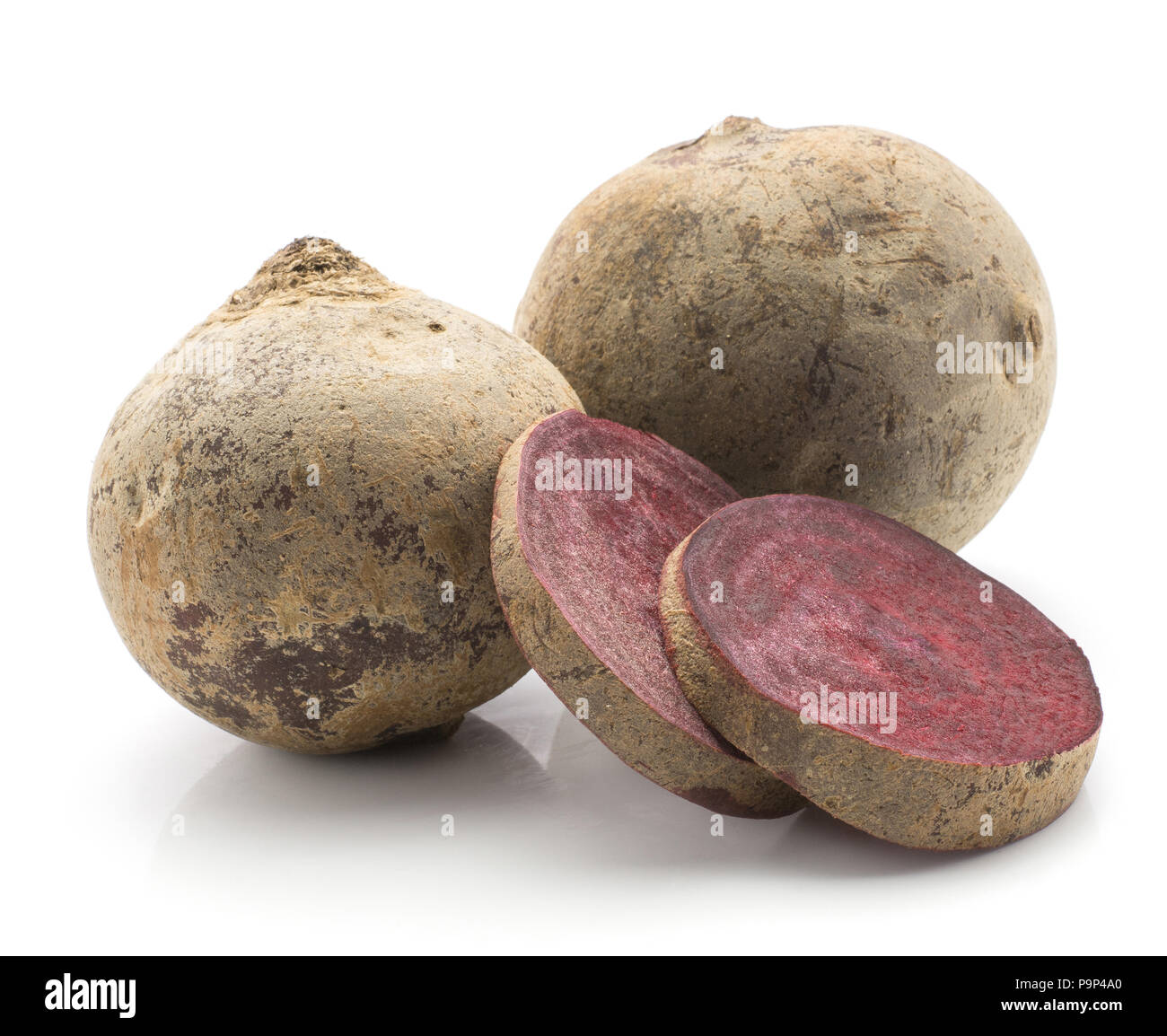 Two beetroot (raw red beet) bulbs and  two slices isolated on white background Stock Photo