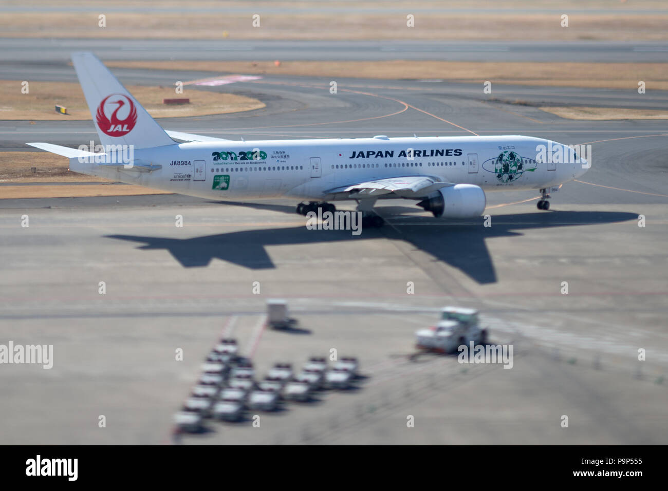 The Boeing 777-200 of JAL - Japan Airlines on the ramp of Haneda airport, Tokyo, Japan. Stock Photo