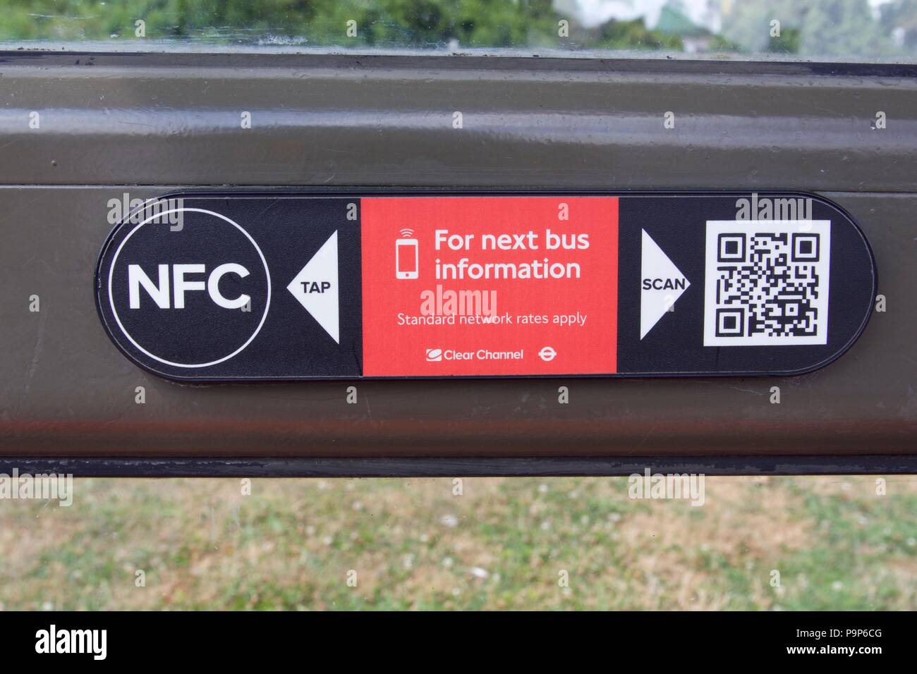 A NFC and QR code on a London Bus stop to get the next bus information Stock Photo