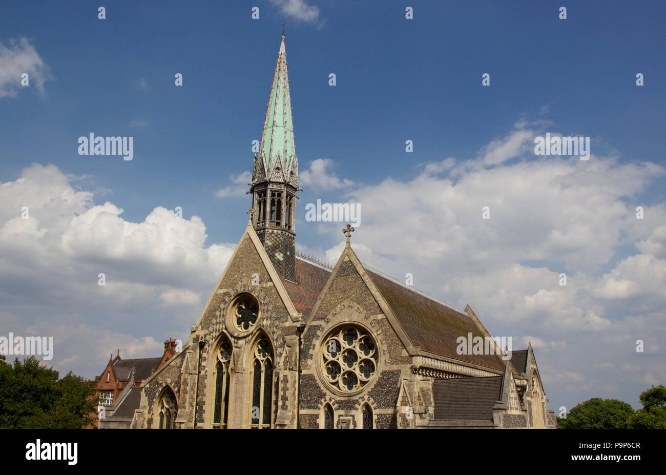 The Harrow School Chapel featuring a green Church Spire. It is a grade II listed building built 1854-57 on High Street, Harrow-On-The-Hill Stock Photo