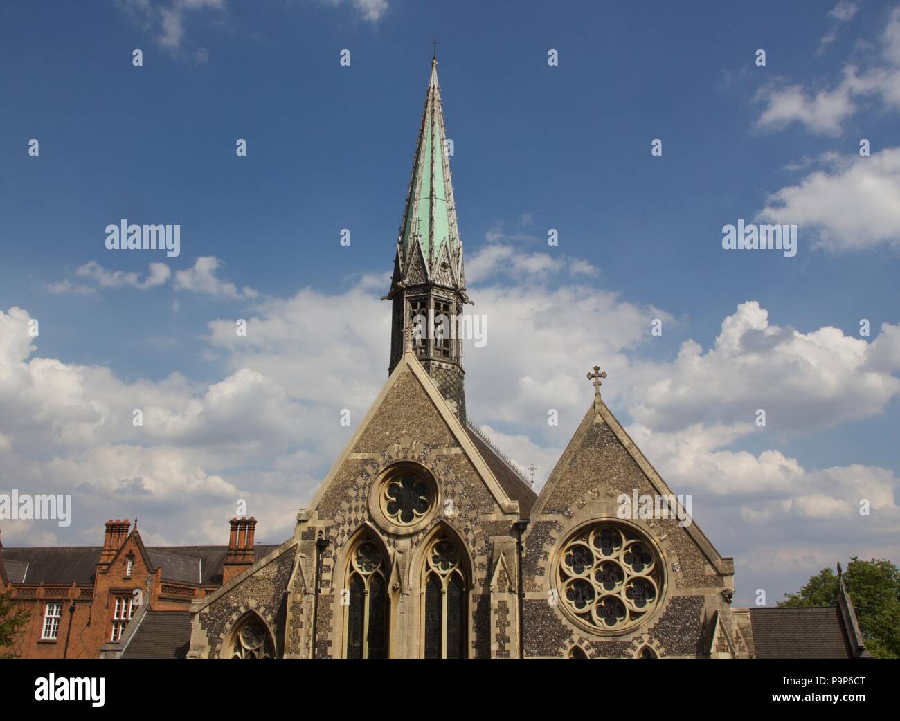 The Harrow School Chapel featuring a green Church Spire. It is a grade II listed building built 1854-57 on High Street, Harrow-On-The-Hill Stock Photo