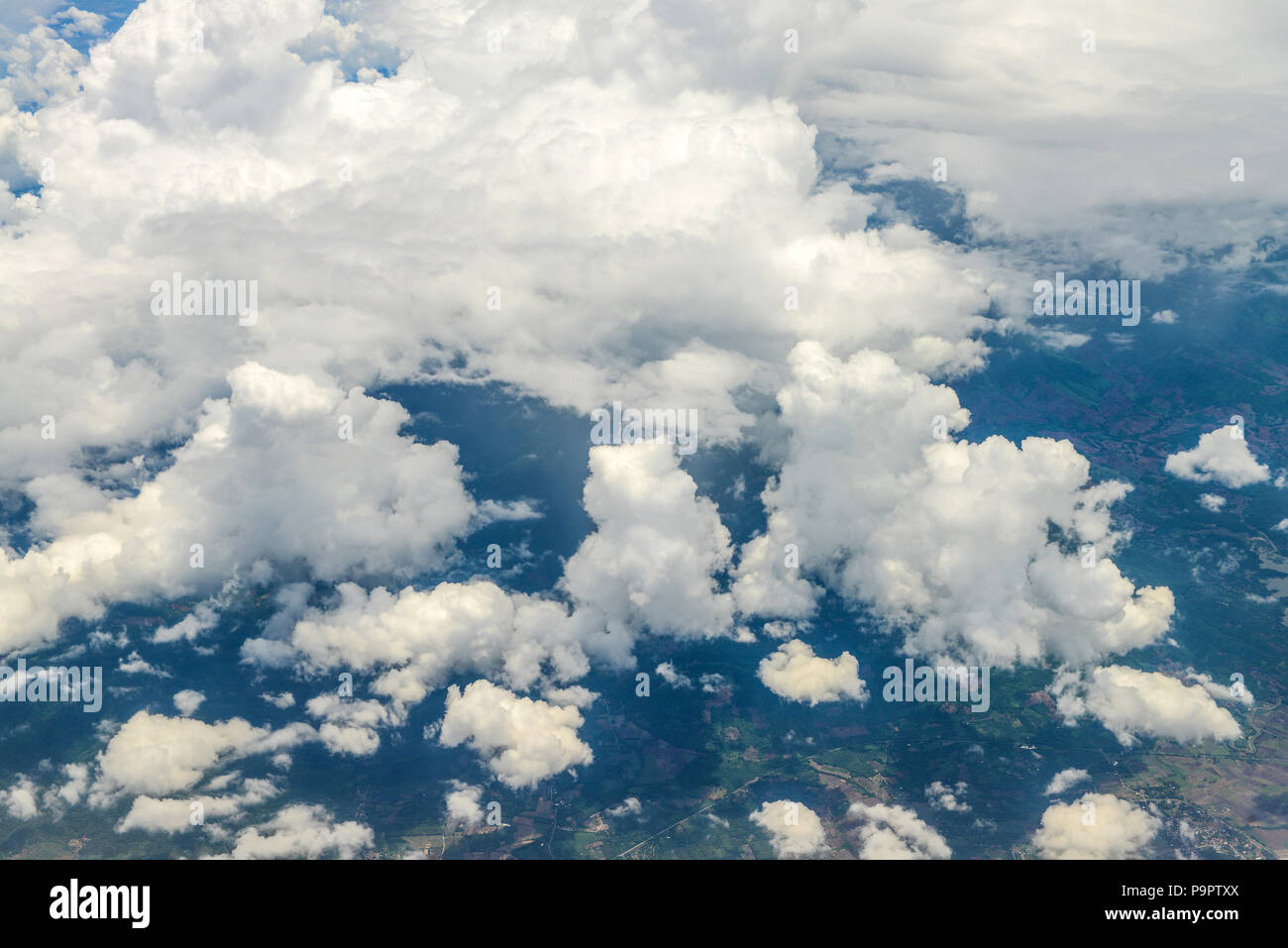 Beautiful view of blue sky above the white clouds and land background ...