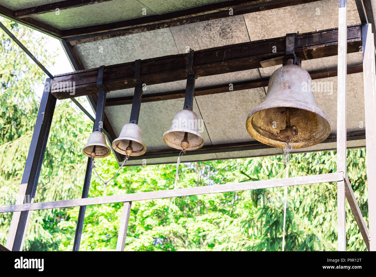 Ancient church bells on an iron fastener Stock Photo Alamy