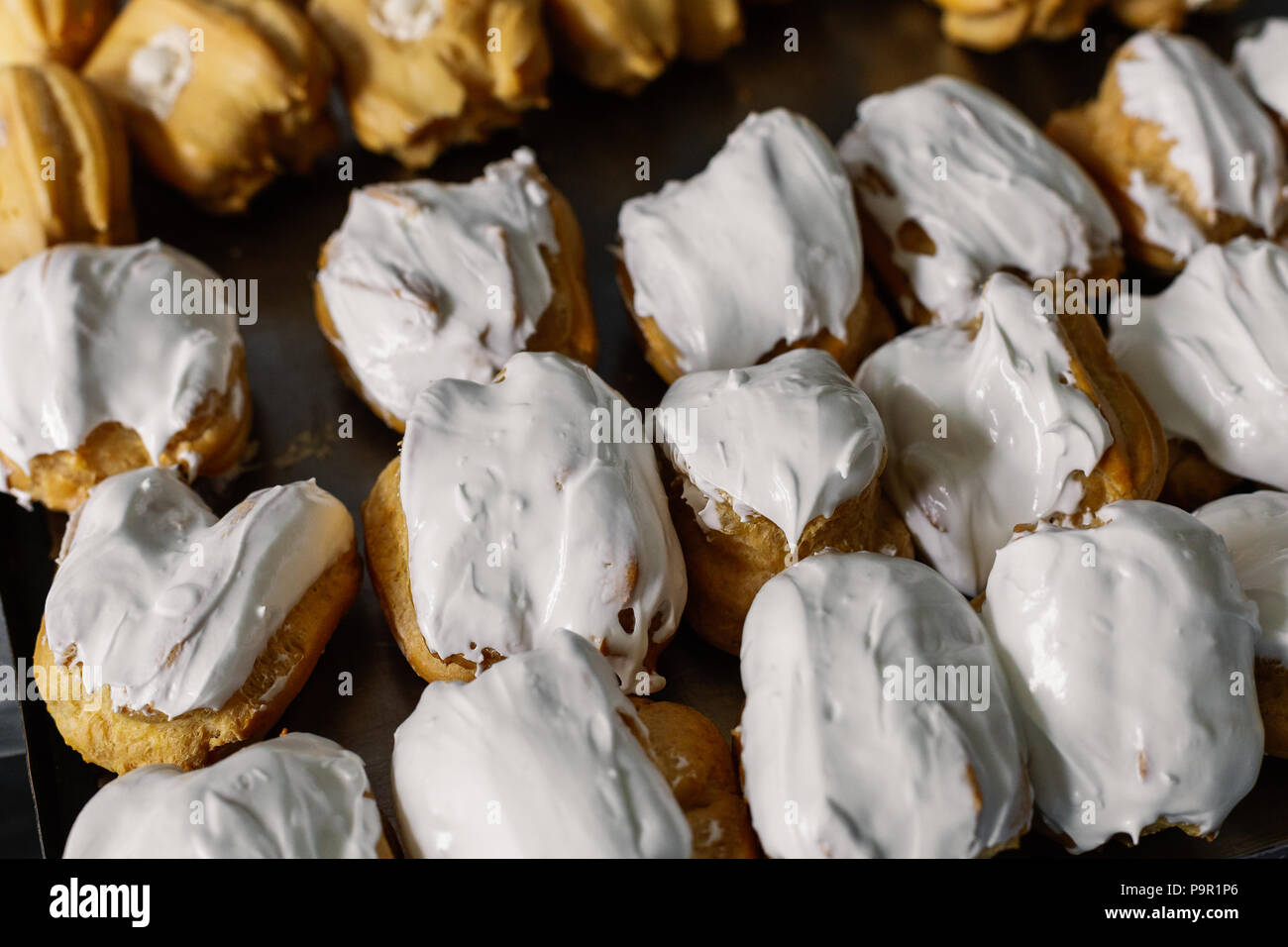 Cakes on a spacing in large quantities. Stock Photo