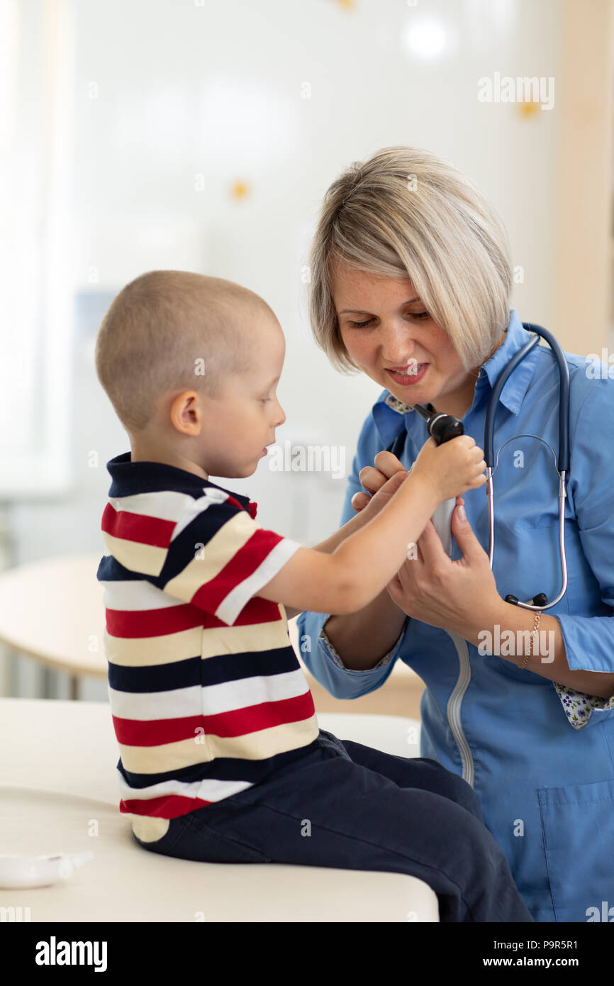 Doctor communicating with kid patient Stock Photo