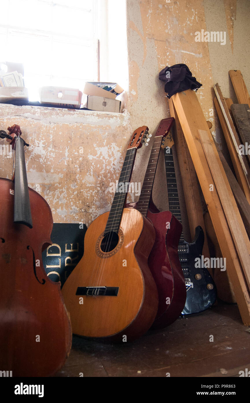 Guitars being repaired in a in Scotland Stock Photo Alamy