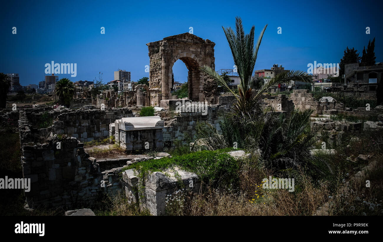 Remains of necropolis and Arch in ancient columns excavation site in Tyre, Lebanon Stock Photo