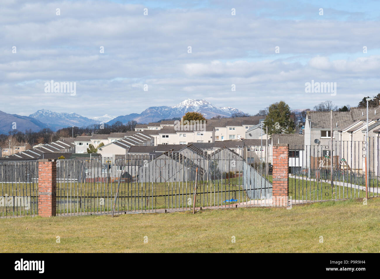 Scottish housing estate or scheme with Ben Lomond in the far distance - Pappert, Bonhill, Scotland, UK Stock Photo