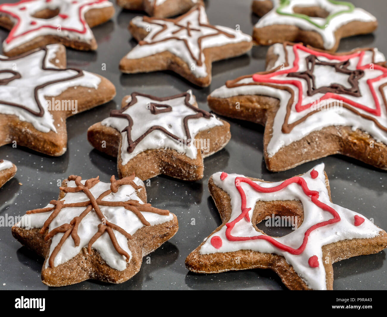Star-shaped seasonal gingerbread cookies with iwhite cing Stock Photo