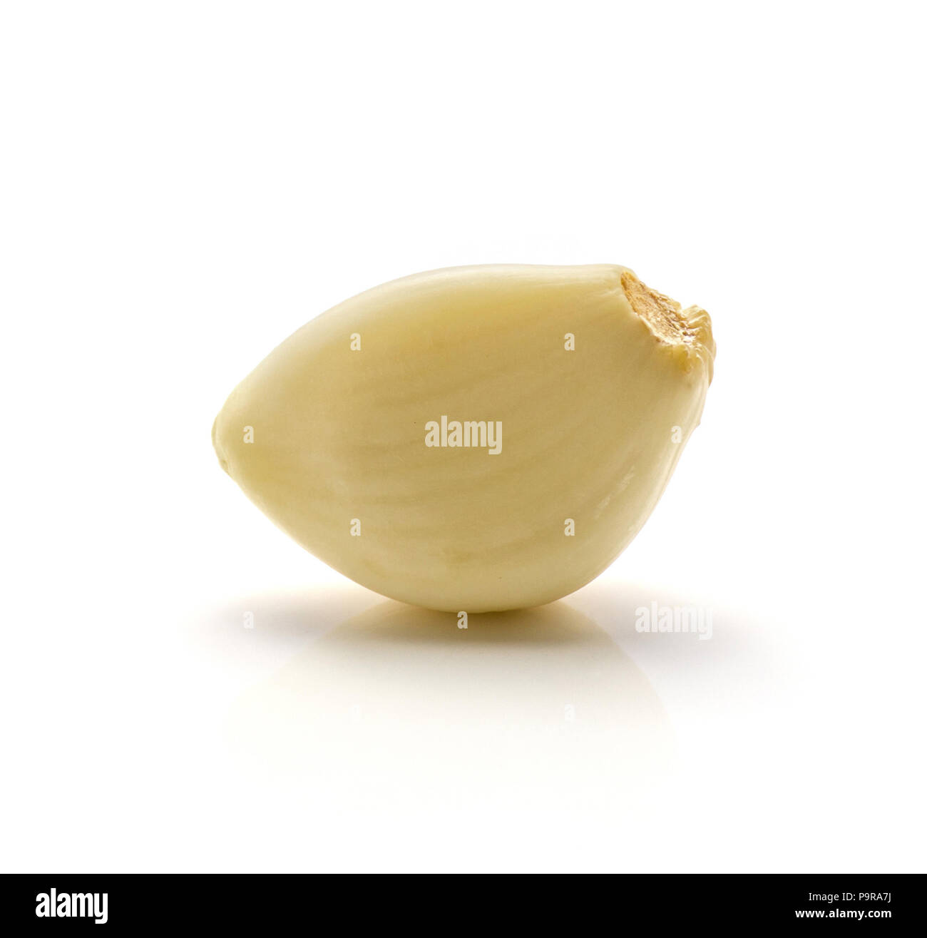One peeled garlic clove isolated on white background Stock Photo - Alamy