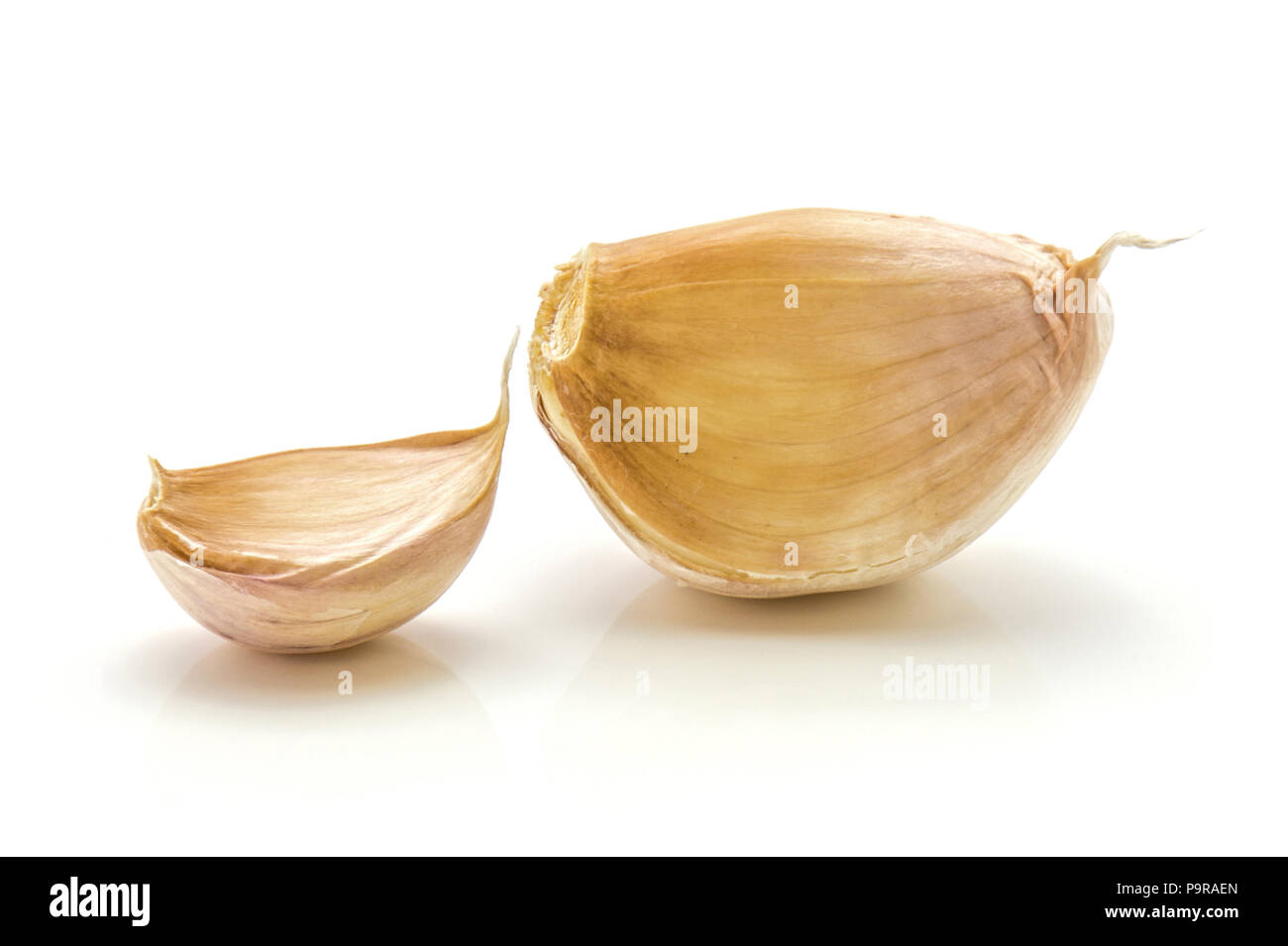 Two garlic cloves isolated on white background Stock Photo
