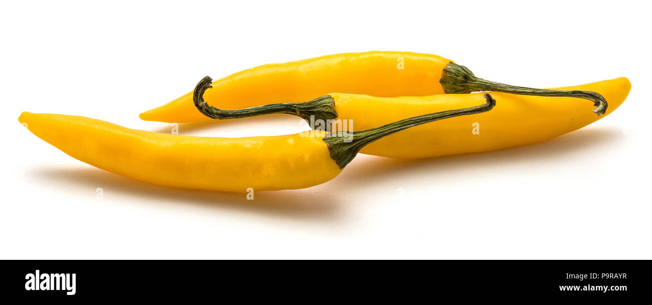 Three yellow Chili pepper isolated on white background Stock Photo - Alamy