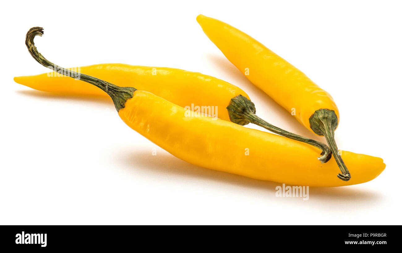 Three yellow Chili pepper isolated on white background Stock Photo - Alamy