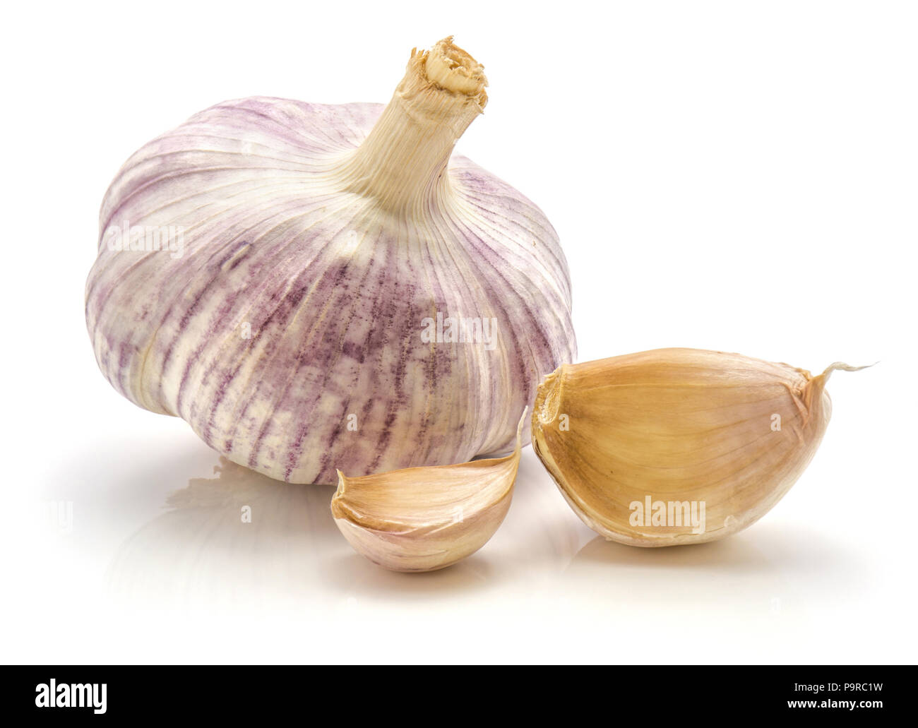 Garlic isolated on white background one whole bulb and two cloves Stock ...