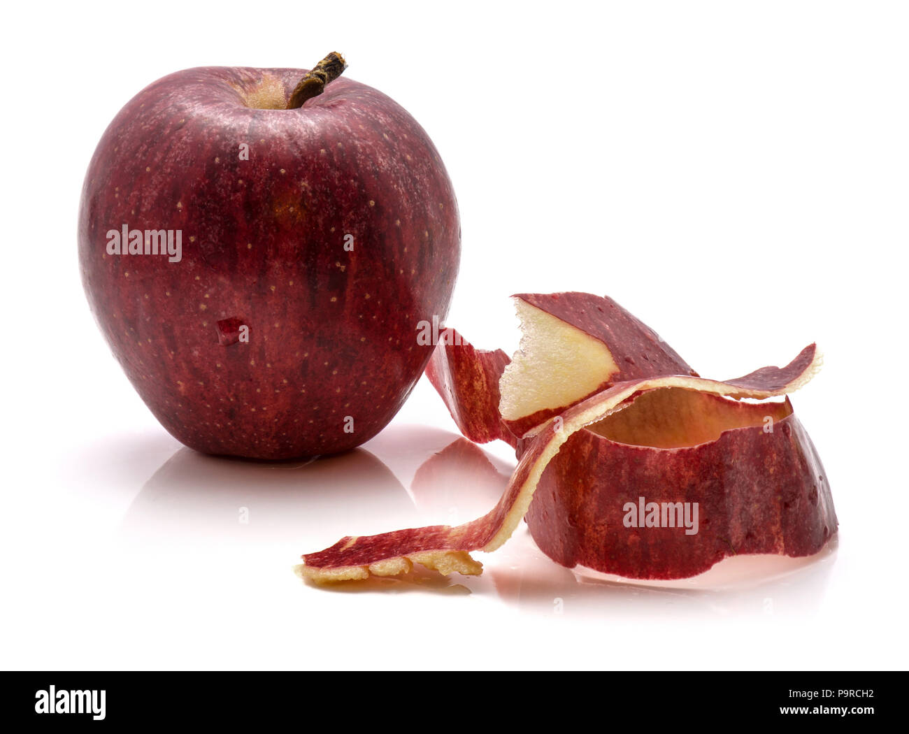One whole Gala apple with separated rind isolated on white background ...