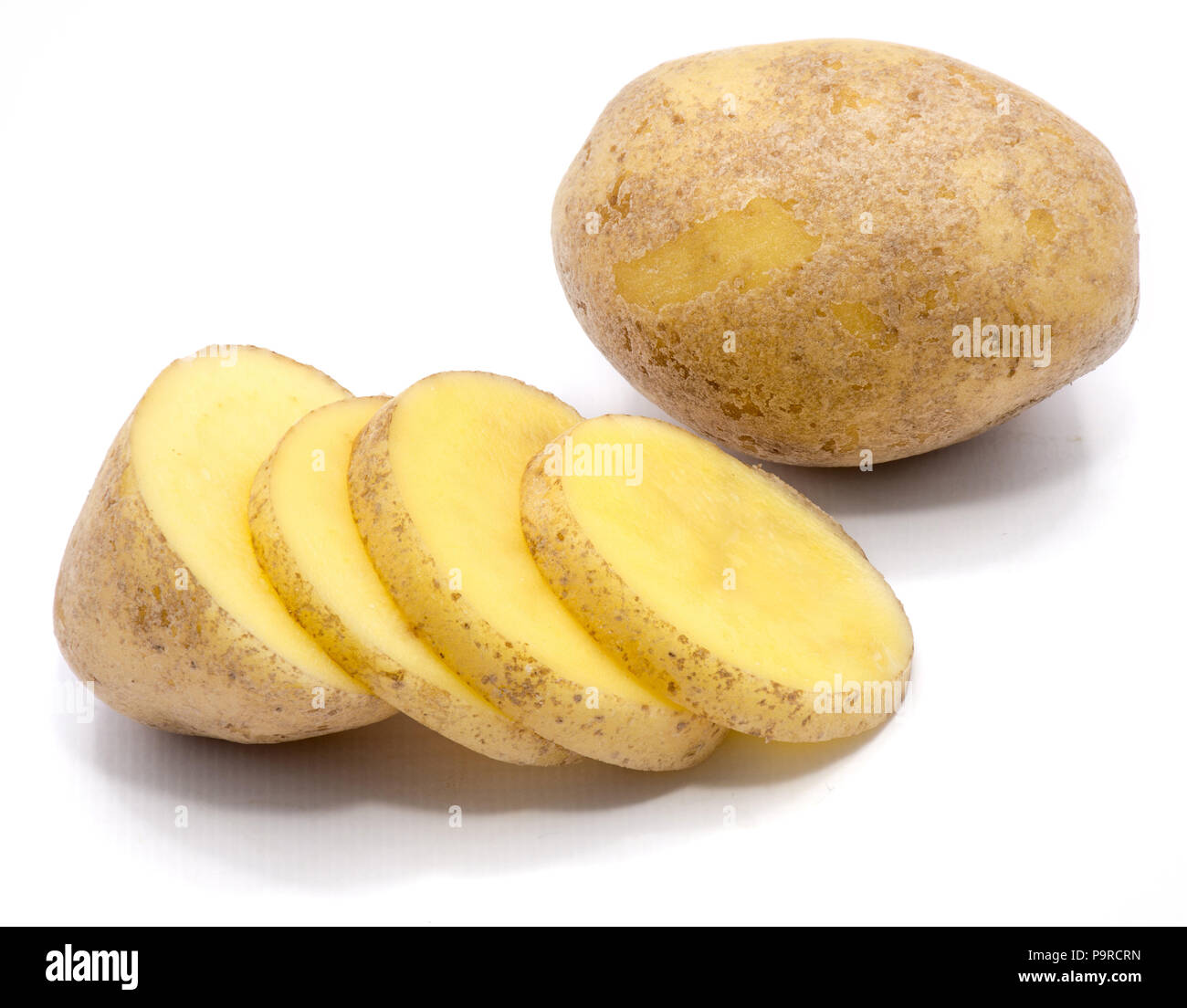 One whole, sliced potato and a half isolated on white background Stock Photo