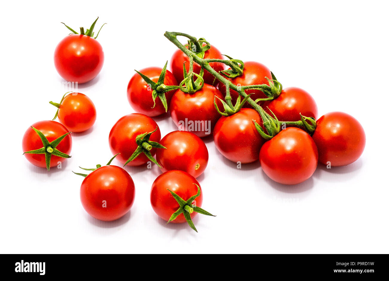 Set of whole fresh red cherry tomatoes on the vine isolated on white ...