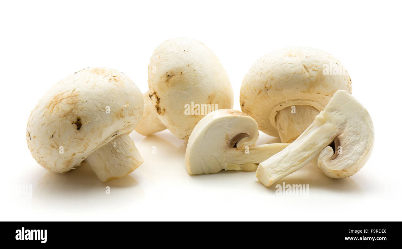 Champignons sliced isolated on white background three whole two quarters Stock Photo