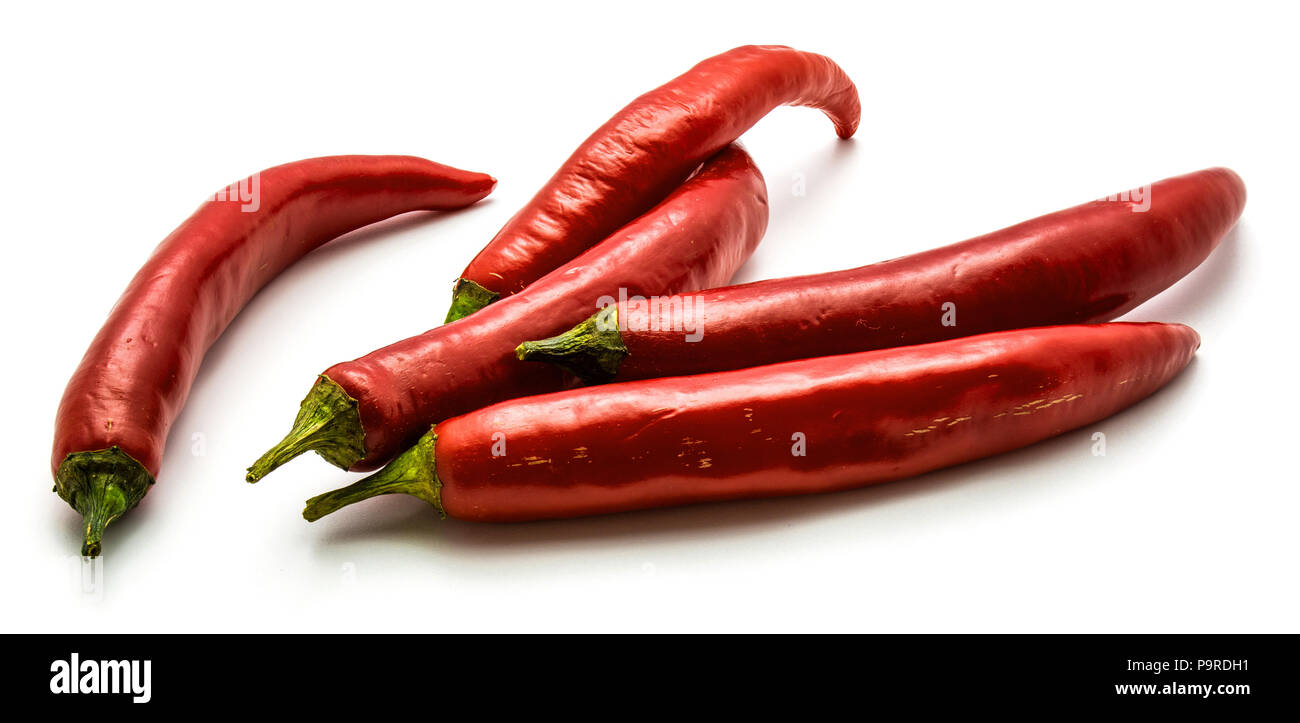 Five red Chili peppers tisolated on white background Stock Photo - Alamy