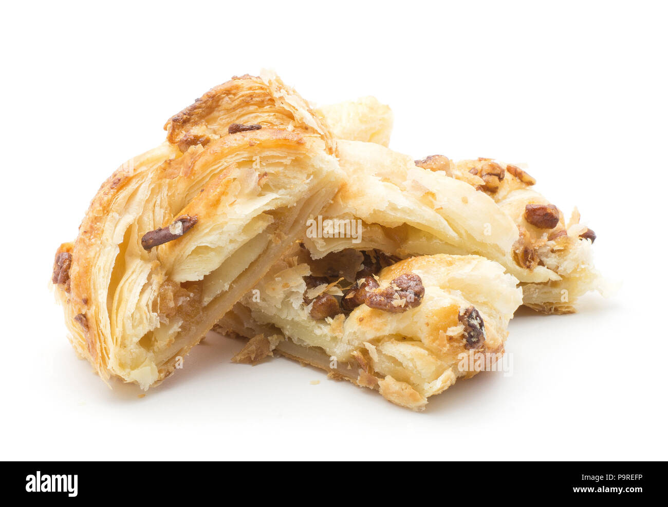 Four sliced twist bread pieces stack with pecan nut and jam inside