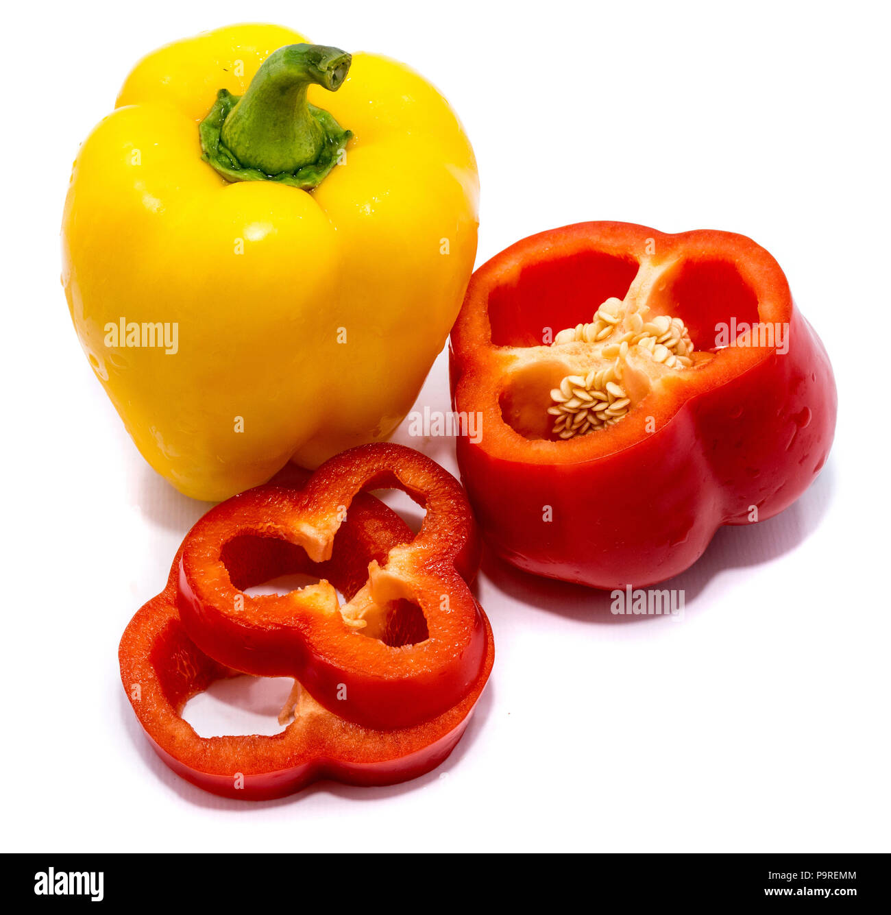 Group of peppers, red pepper slices, red cut piece of pepper and whole