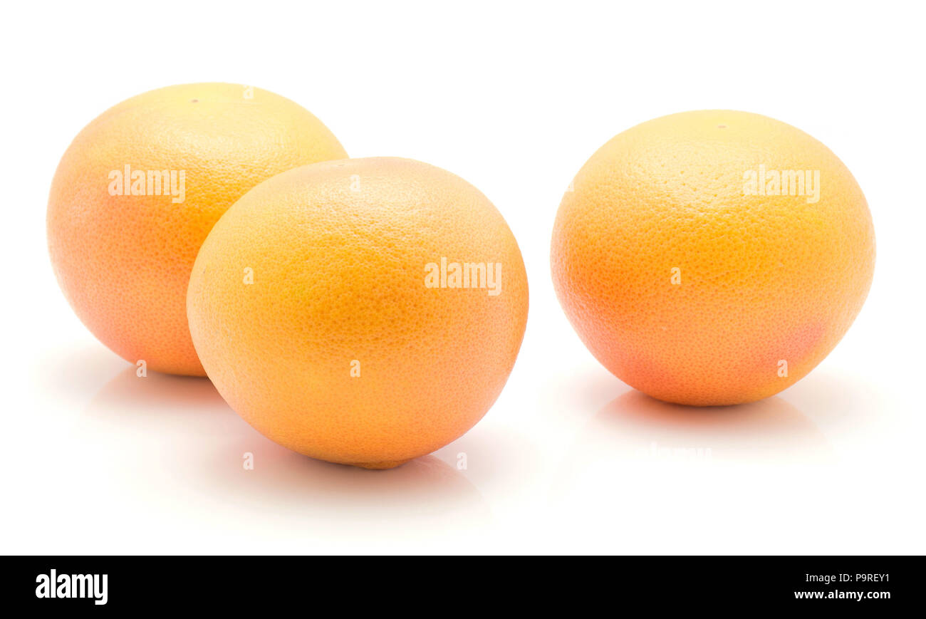 Red grapefruits isolated on white background three whole Stock Photo