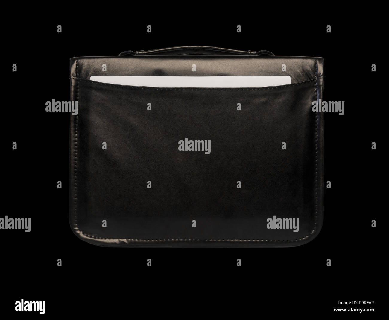 black leather briefcase with documents close-up isolated on a black