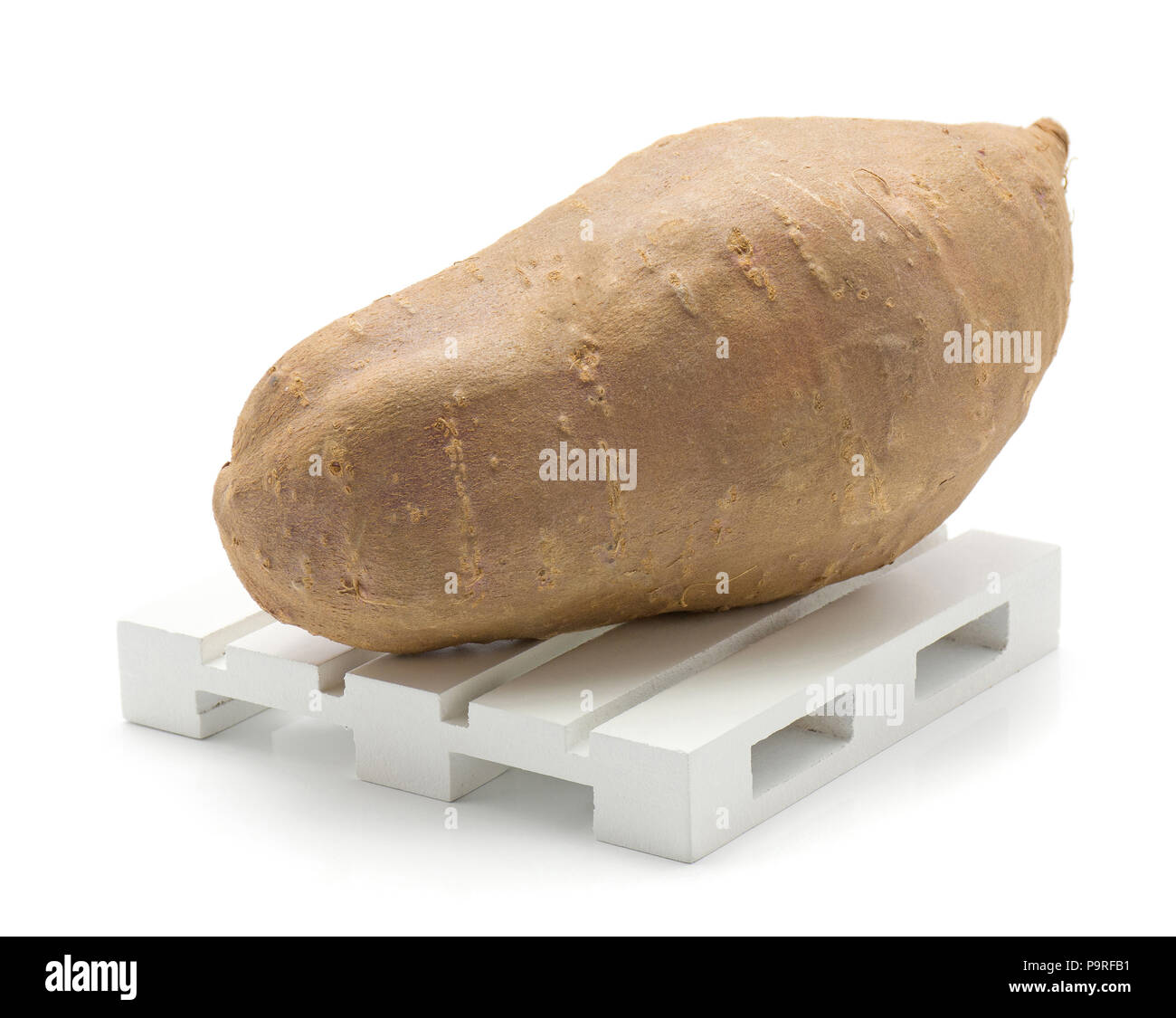 Sweet potato on a pallet isolated on white background one whole Stock Photo