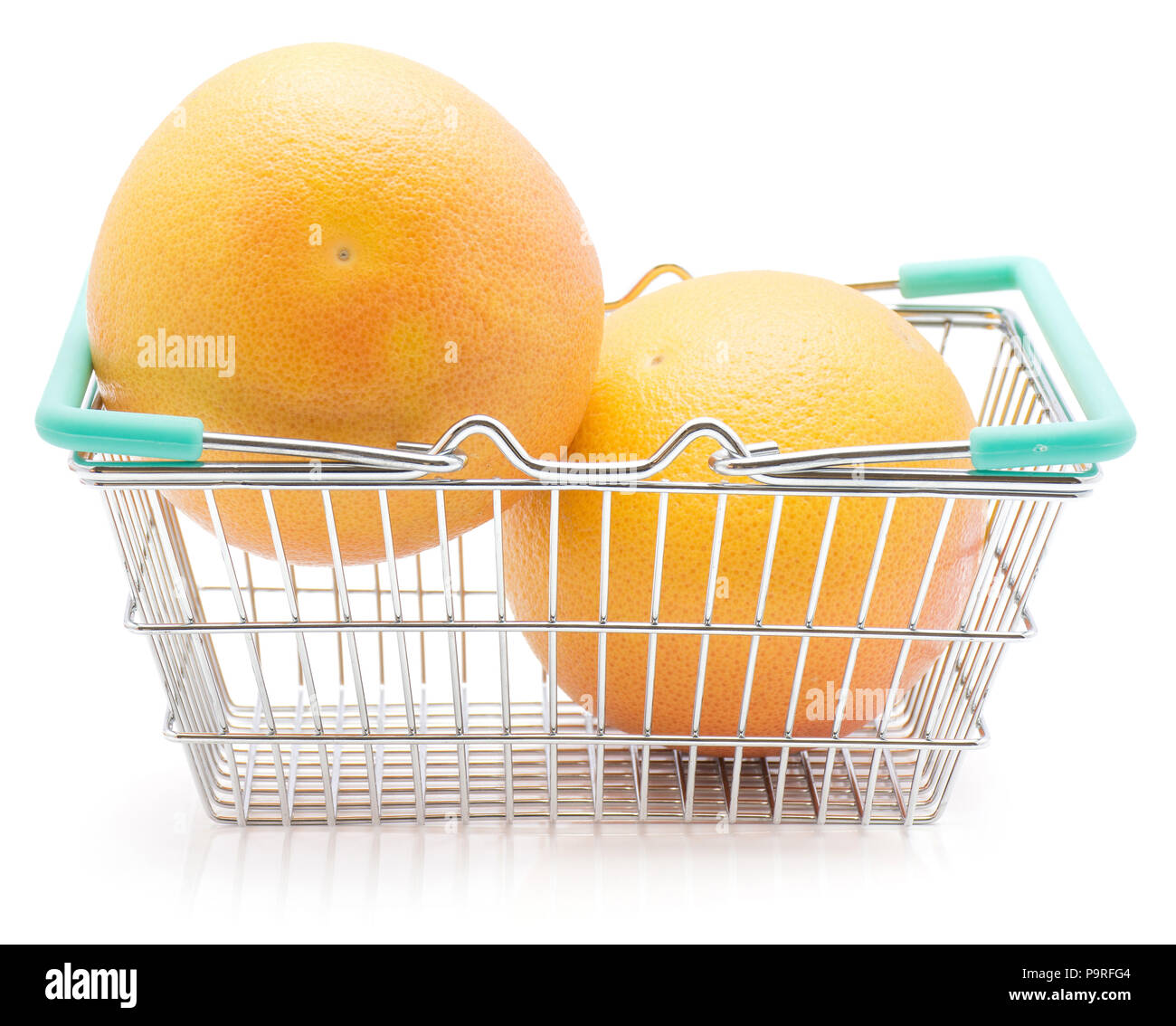 Two red grapefruits in a shopping basket isolated on white background