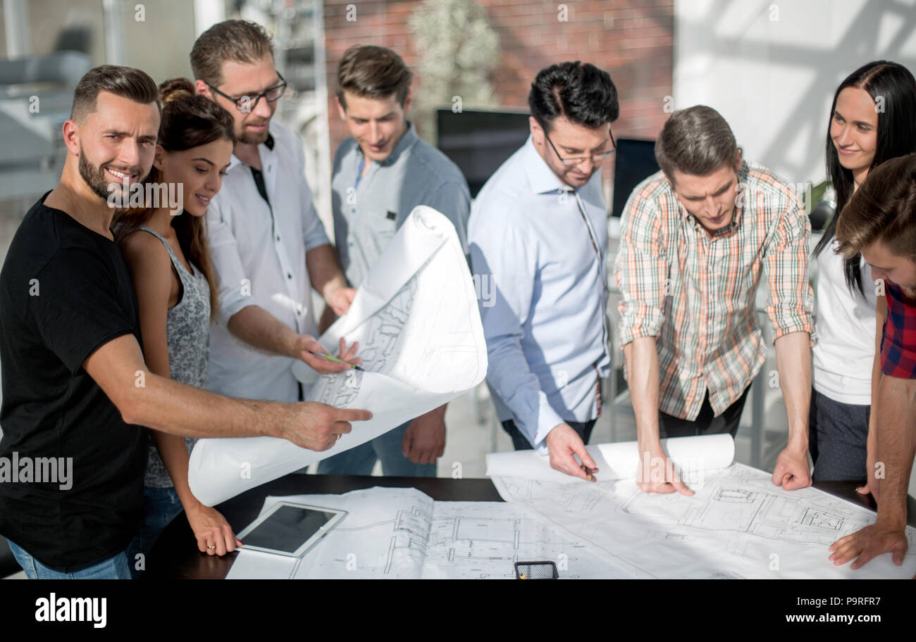 architect explaining to designers the features of the project Stock ...