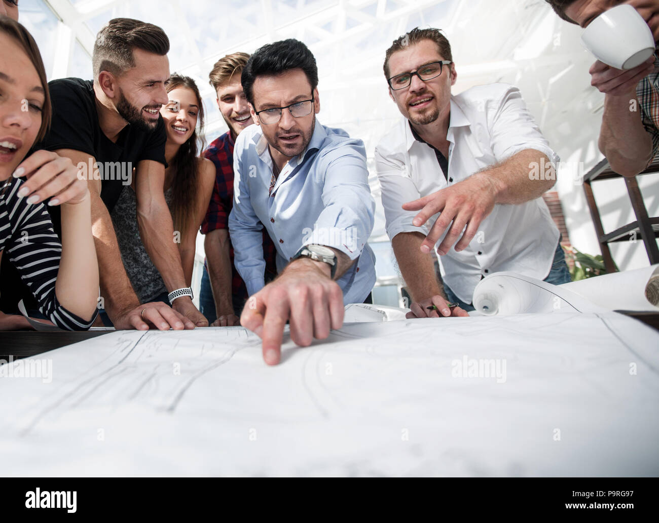 team of architects is discussing a new project Stock Photo