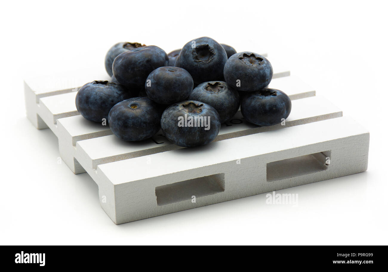 Bog blueberries on a pallet isolated on white background Stock Photo