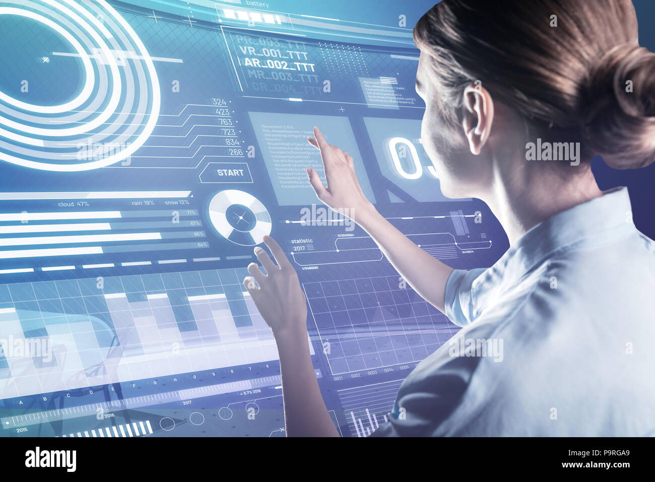 Careful touch. Skilled experienced programmer gently touching the transparent device while working at the new program Stock Photo